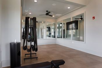 Personal training room with peloton and free weights